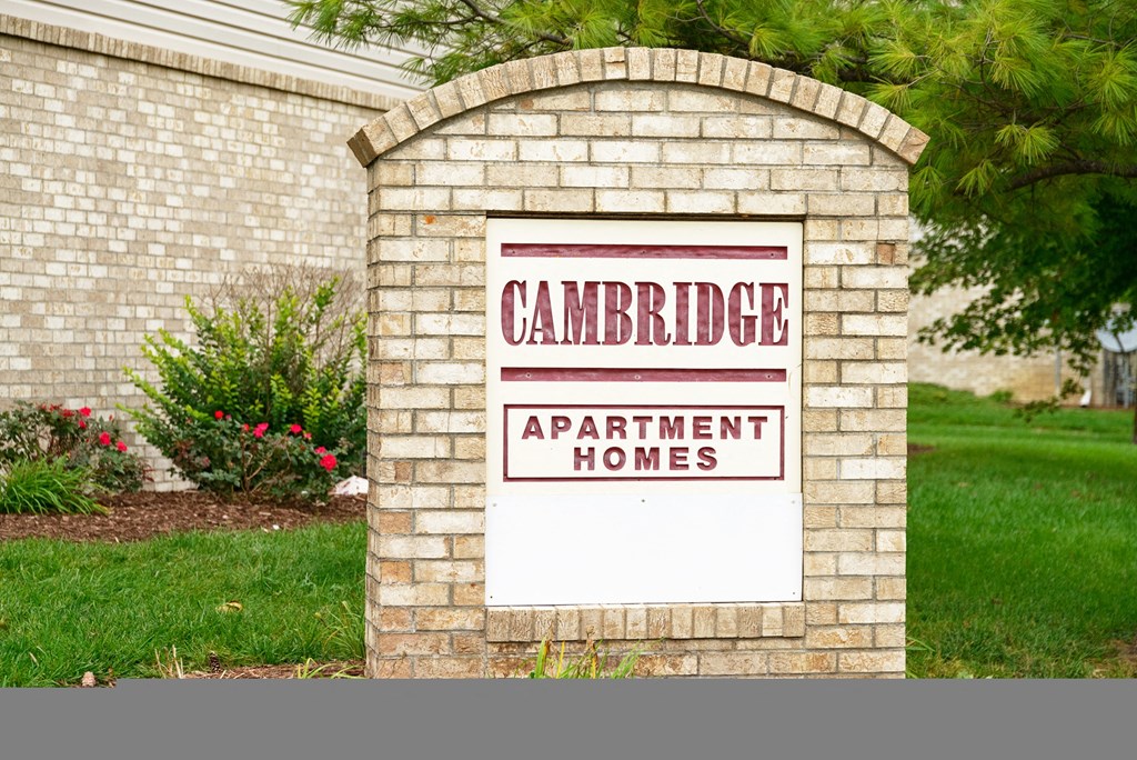 a sign in front of a house that says apartment homes