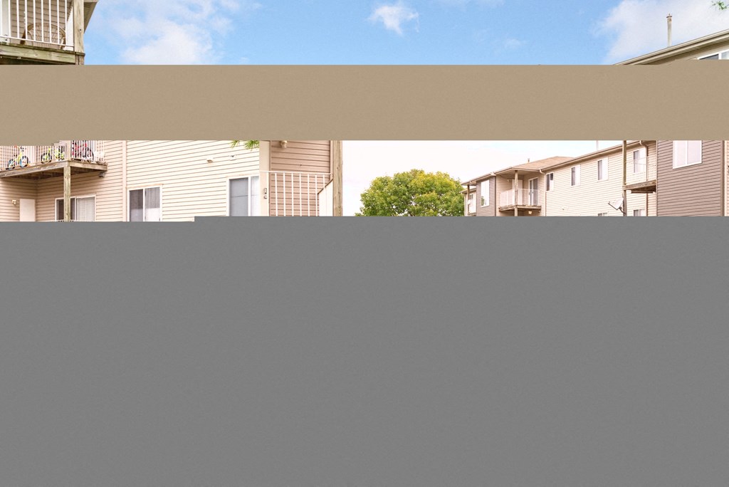 the view from the balcony of an apartment building