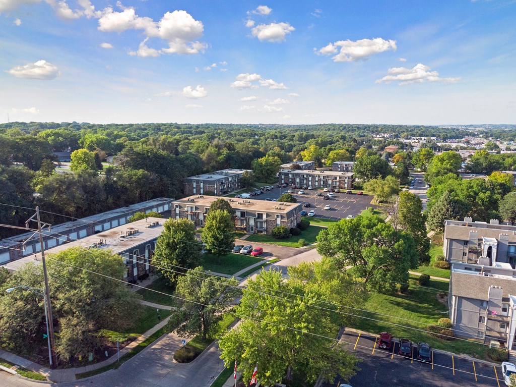 an aerial view of a city with buildings and trees