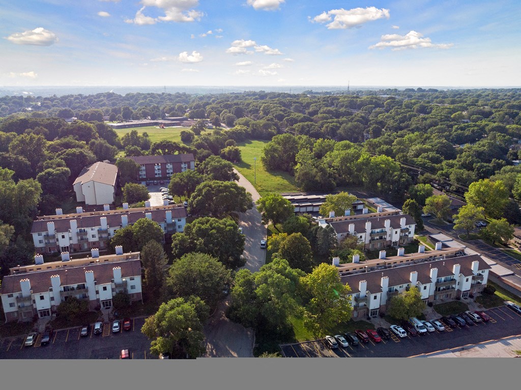 an aerial view of a neighborhood with trees and buildings