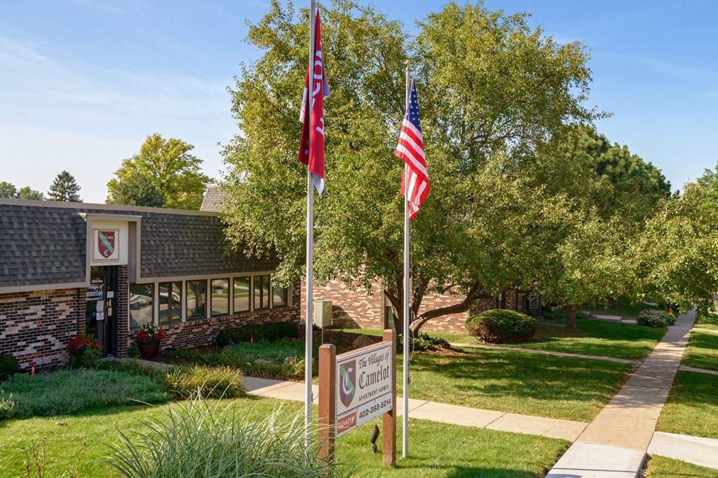 two flags in front of a building