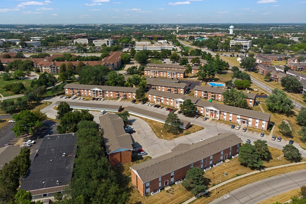 an aerial view of a city with brick buildings and trees