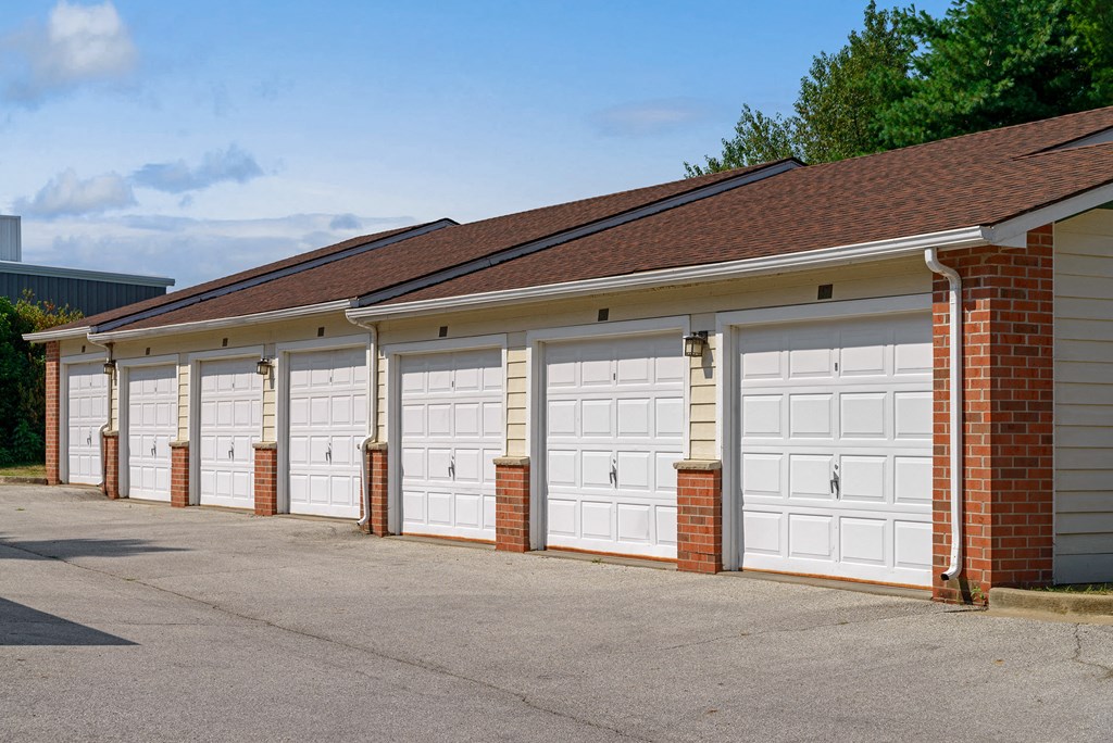 a row of garages with white garage doors