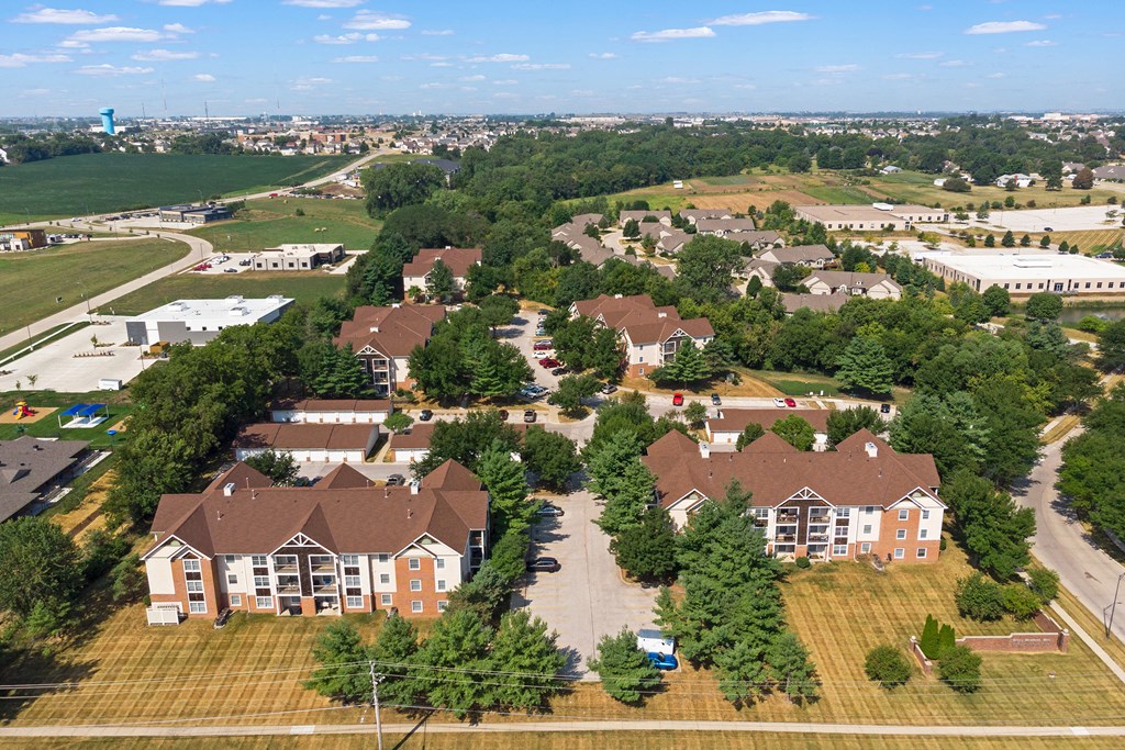 an aerial view of a neighborhood with houses and trees