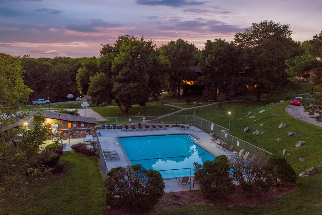 a aerial view of a swimming pool at dusk