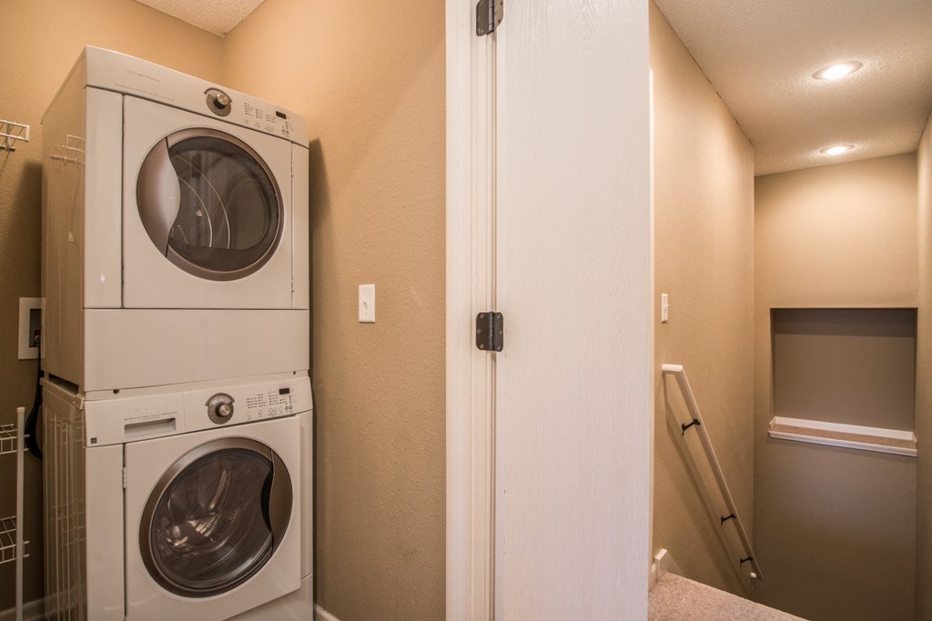the washer and dryer in the laundry room of a home