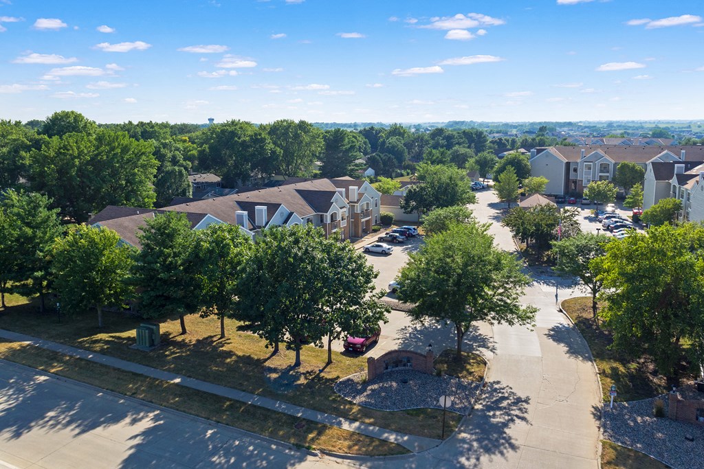 an aerial view of a neighborhood with houses and trees