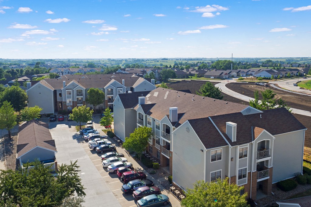 an aerial view of a neighborhood with houses and cars parked