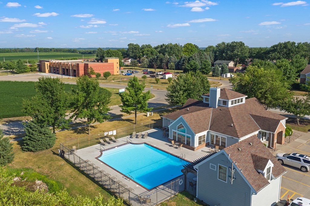 an aerial view of a house with a swimming pool