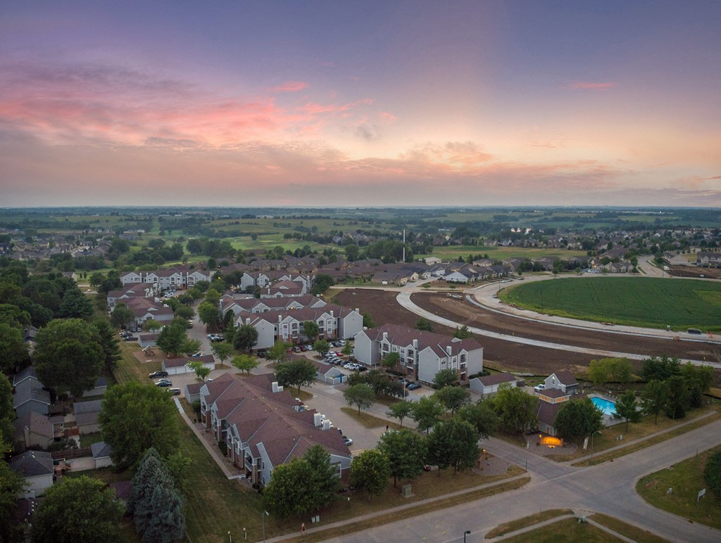 an aerial view of a suburb of a city with houses and a highway