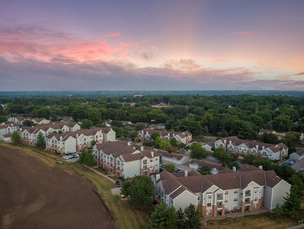 an aerial view of a neighborhood with houses and trees