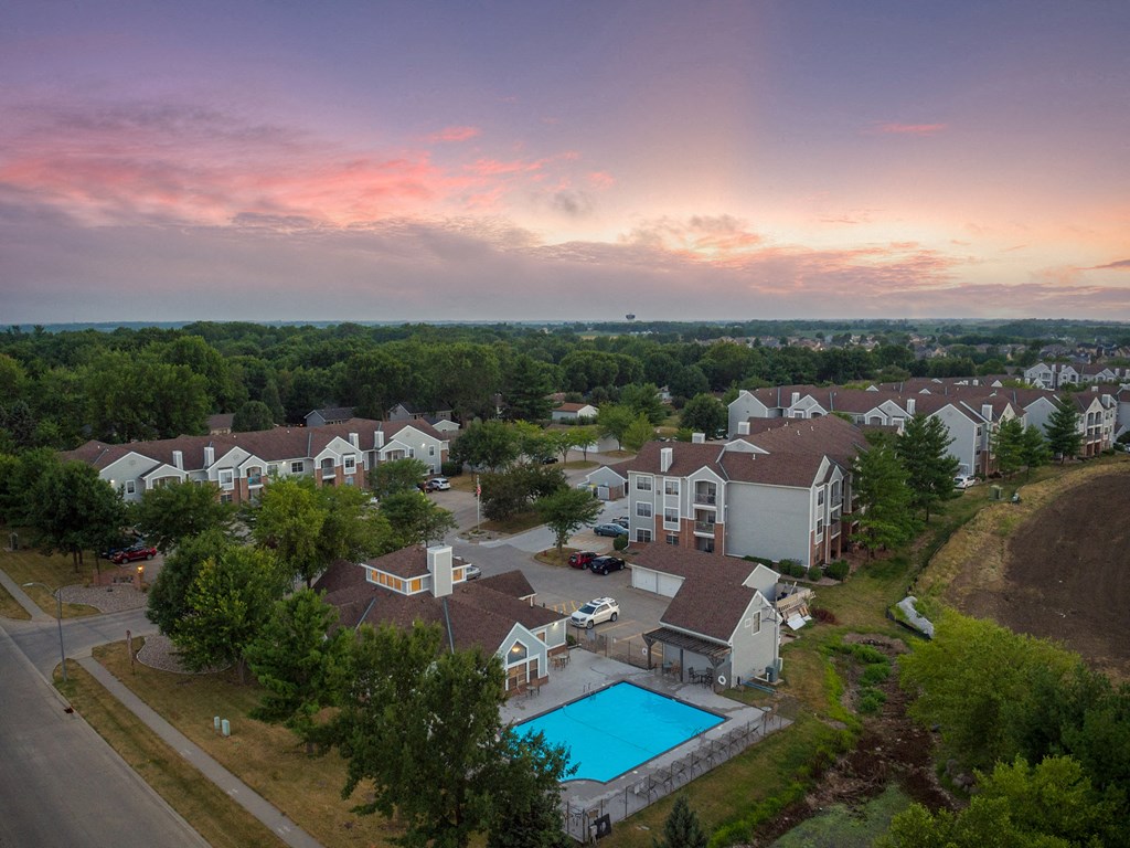 an aerial view of a neighborhood with a swimming pool and houses