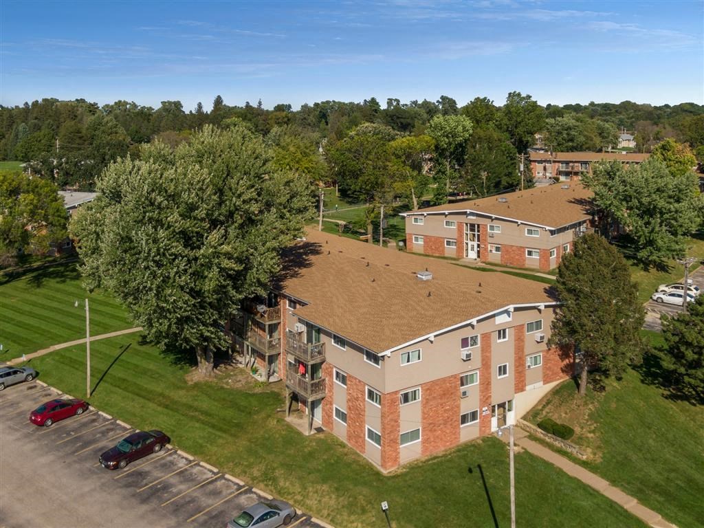 an aerial view of a building with a brown roof