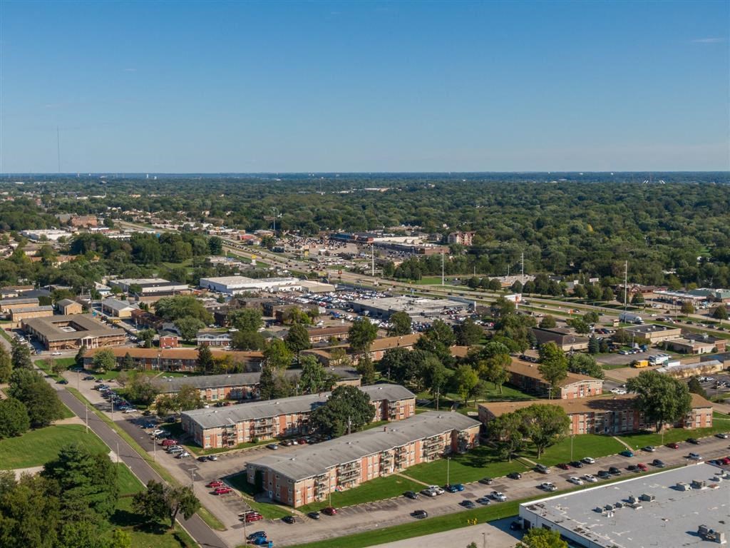 an aerial view of a city with buildings and trees