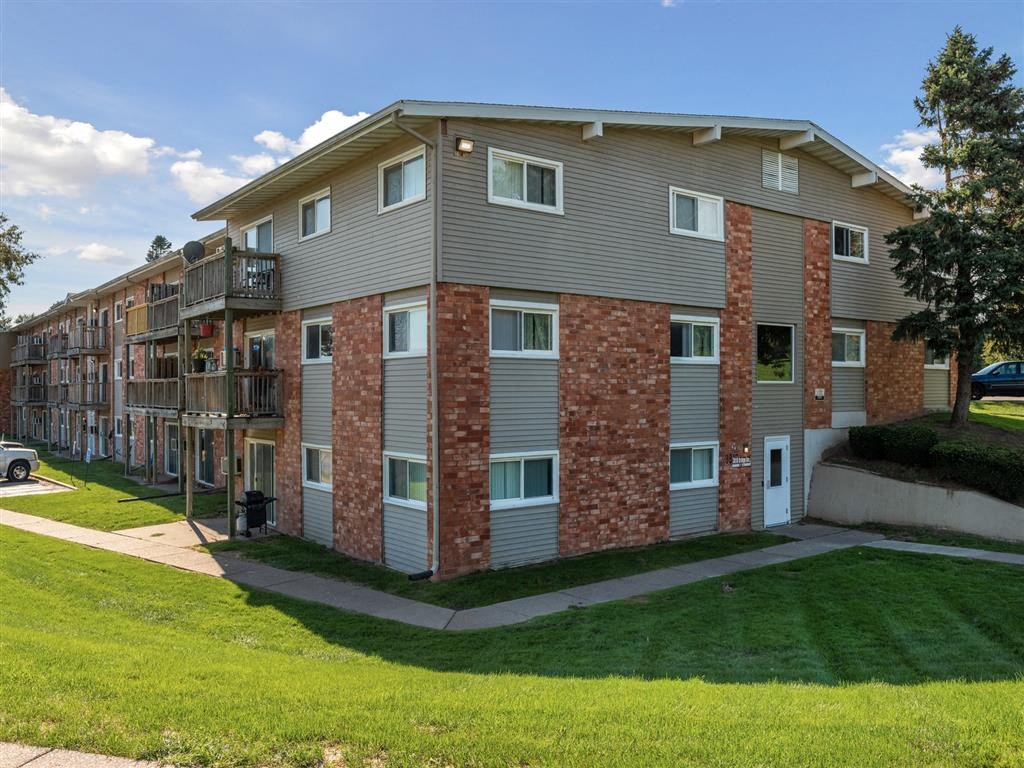 our apartments are located in a quiet neighborhood with green grass