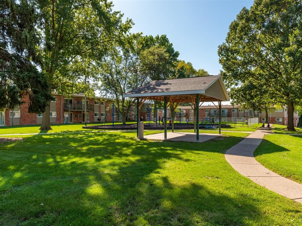 a picnic pavilion in the middle of a park