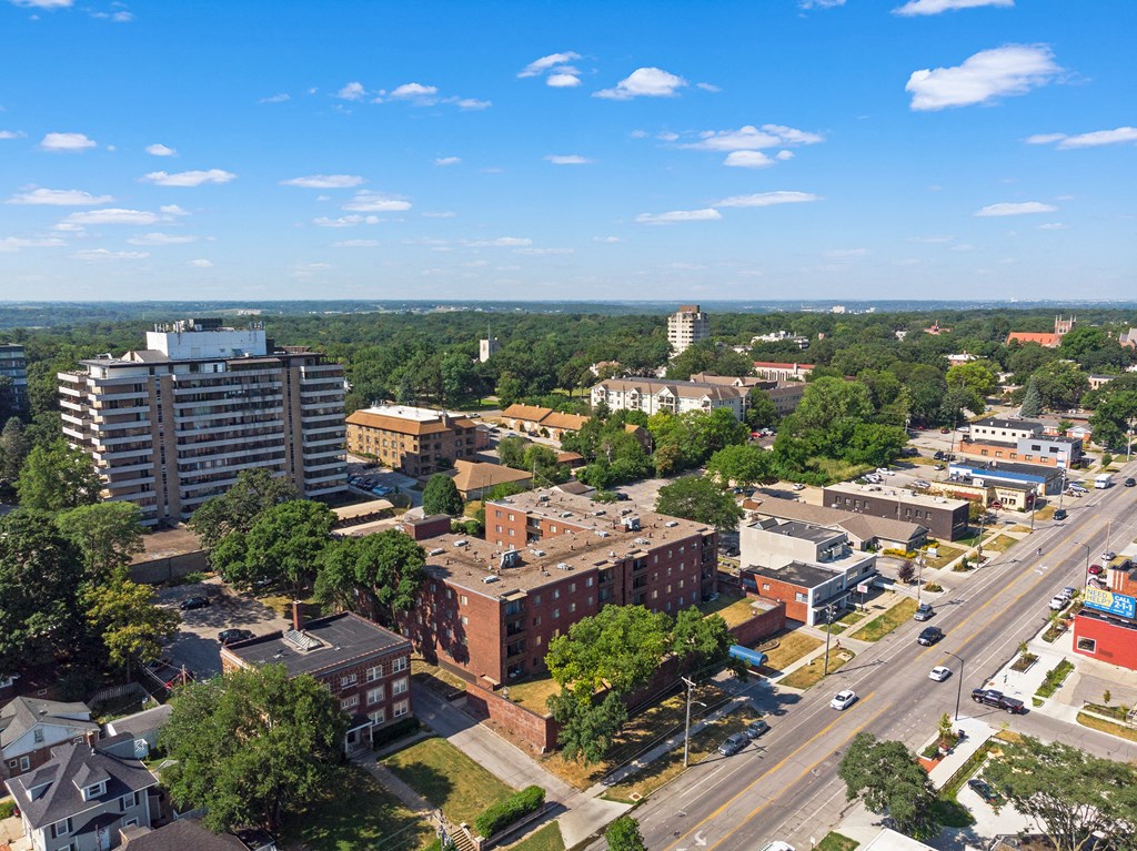 an aerial view of a city with buildings and trees