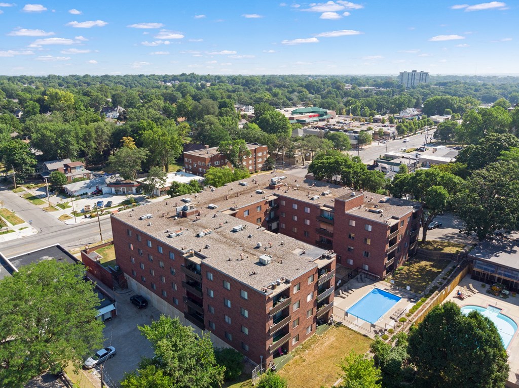 an aerial view of a brick building in the city