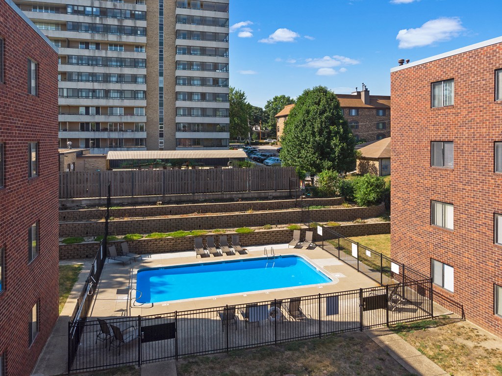 an aerial view of a swimming pool in the middle of a building
