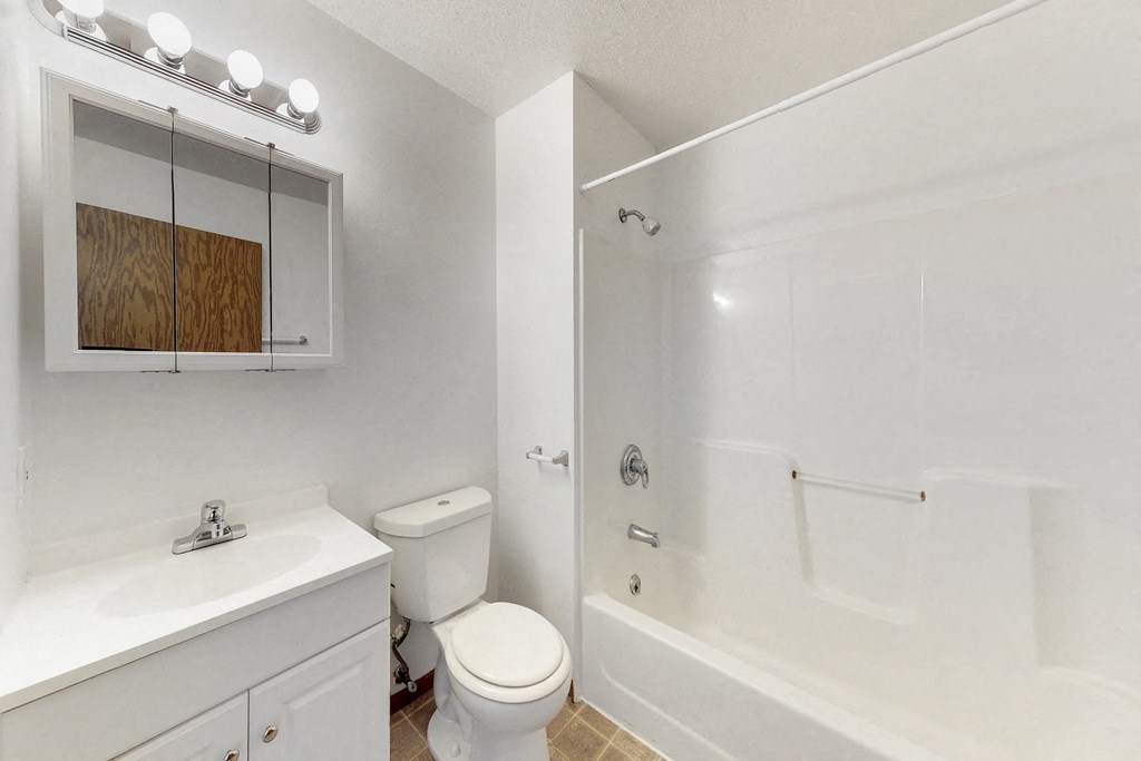 a bathroom with a sink toilet and a shower
