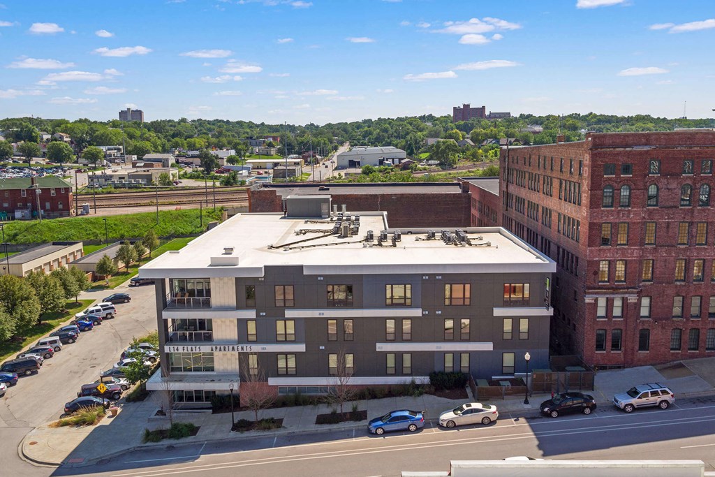 an aerial view of a building with a parking lot