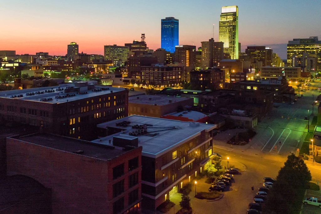 a city at night with the skyline in the background