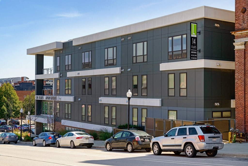 a building with cars parked in front of it