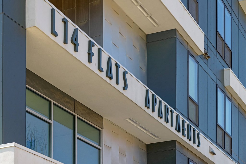 a sign on the side of an office building