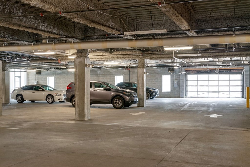 a parking garage with cars parked in it
