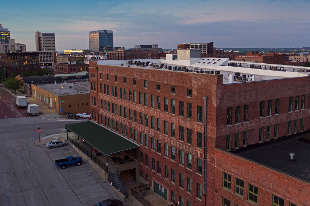 a view of the city from the roof of a brick building