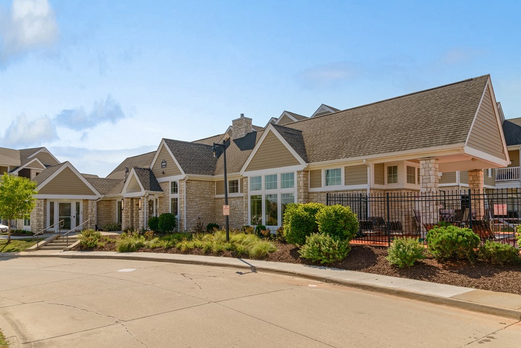 a row of houses with a street in front of them