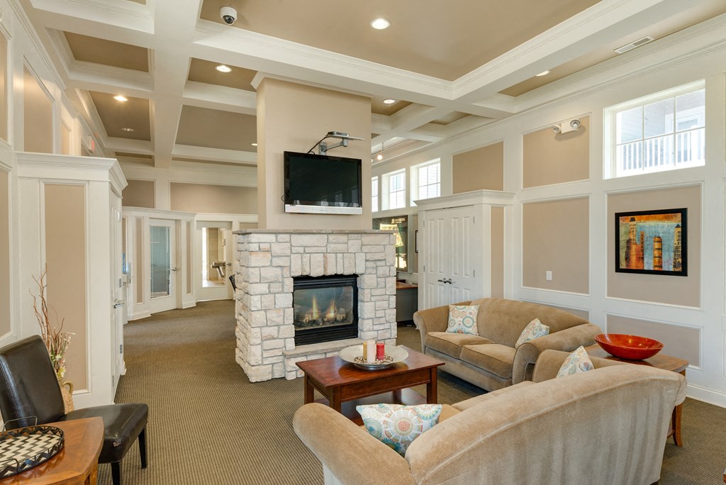 a living room with couches and a fireplace