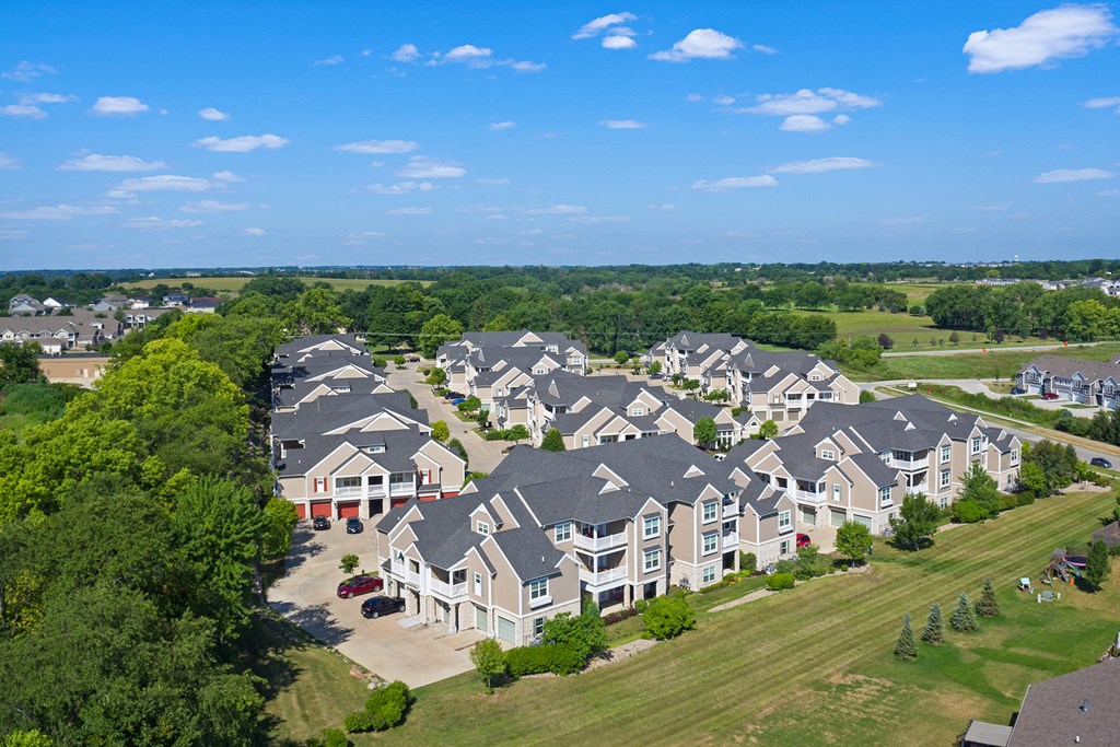 an aerial view of rows of houses in a suburban neighborhood