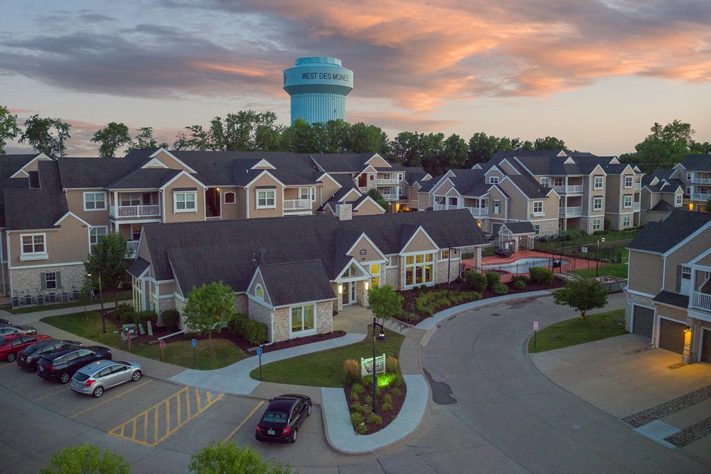 a neighborhood of houses with a water tower in the background