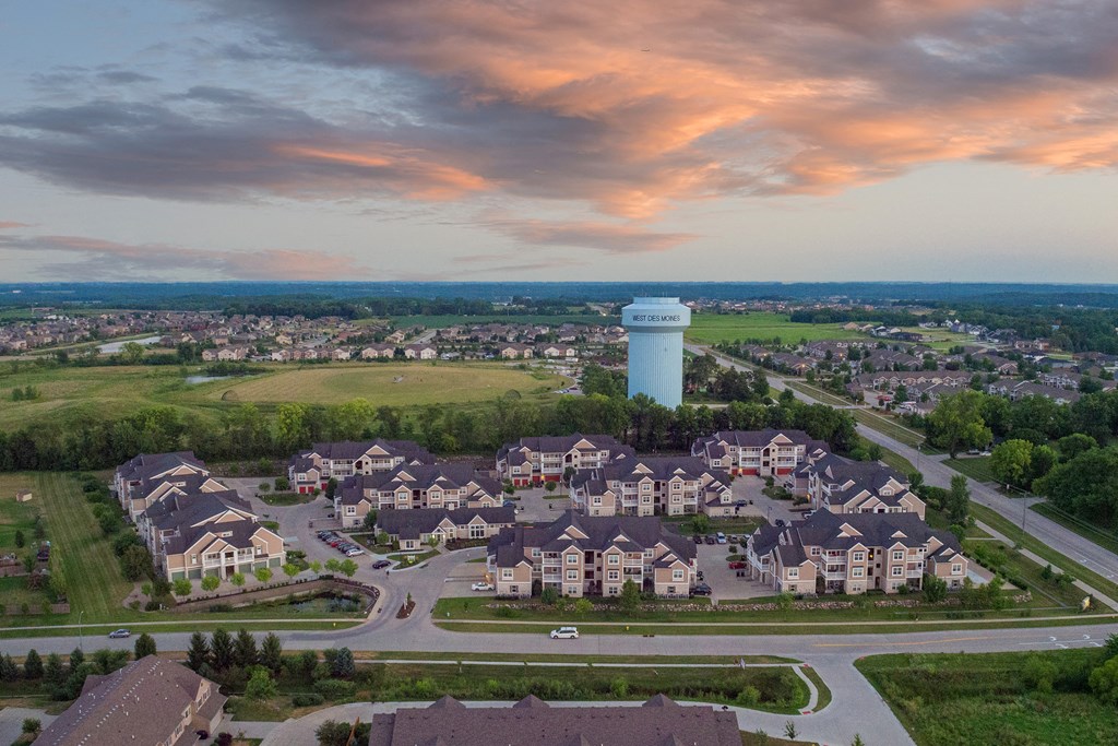 an aerial view of a suburb of a city with a water tower