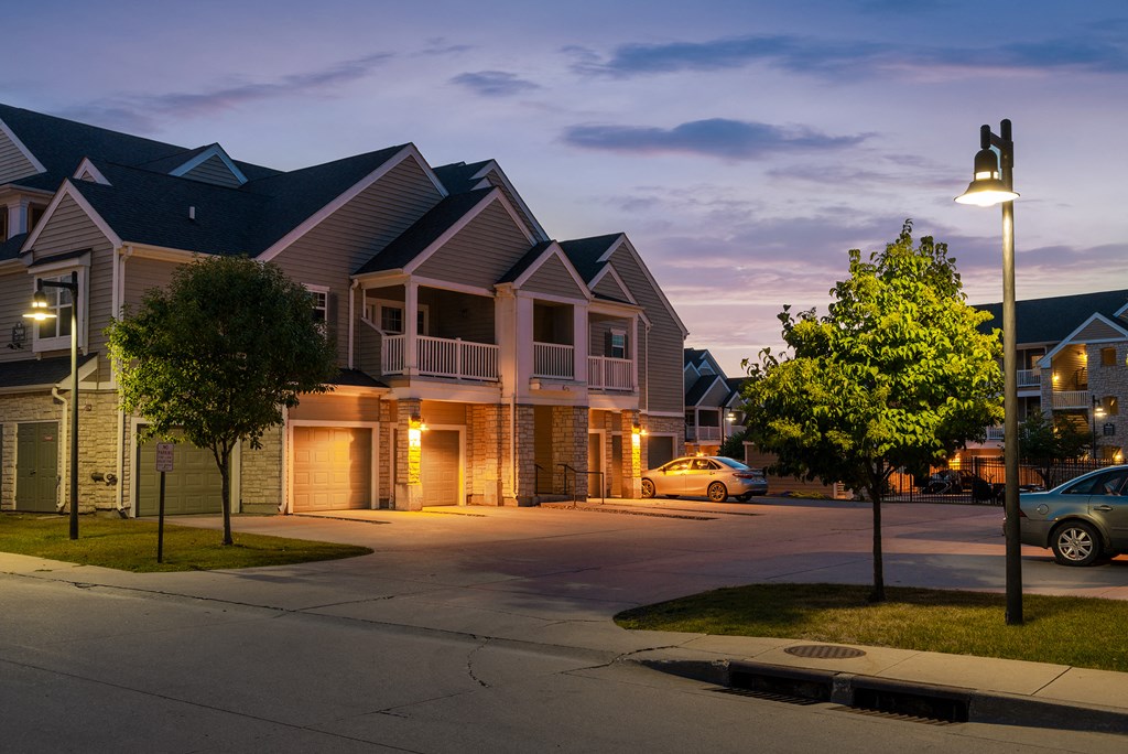 a row of houses on a city street at night