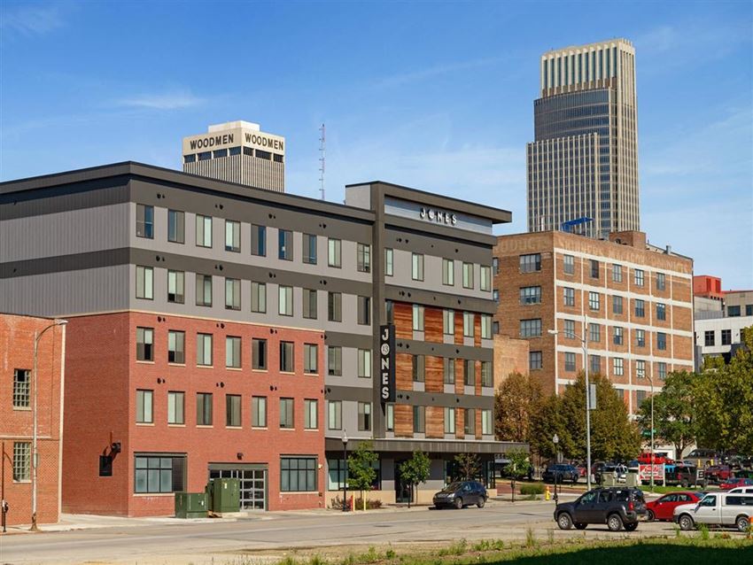 a view of a building in front of a city street