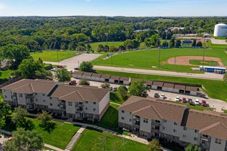 an aerial view of a group of buildings and a baseball field