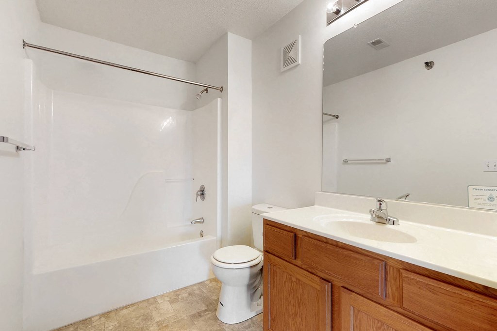 a bathroom with a sink toilet and a shower