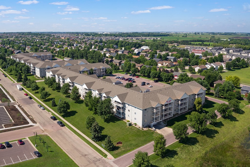 an aerial view of an apartment complex in the suburbs