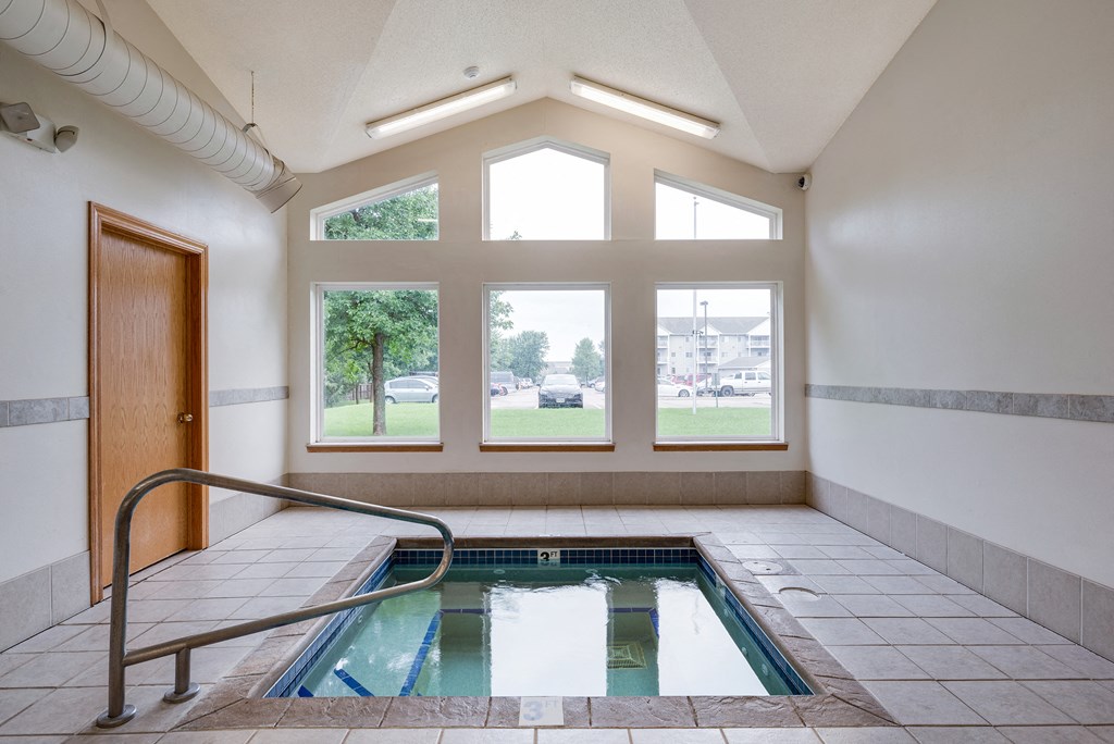 the indoor pool is located in a large room with large windows