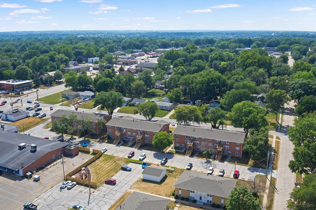 an aerial view of a neighborhood with buildings and trees