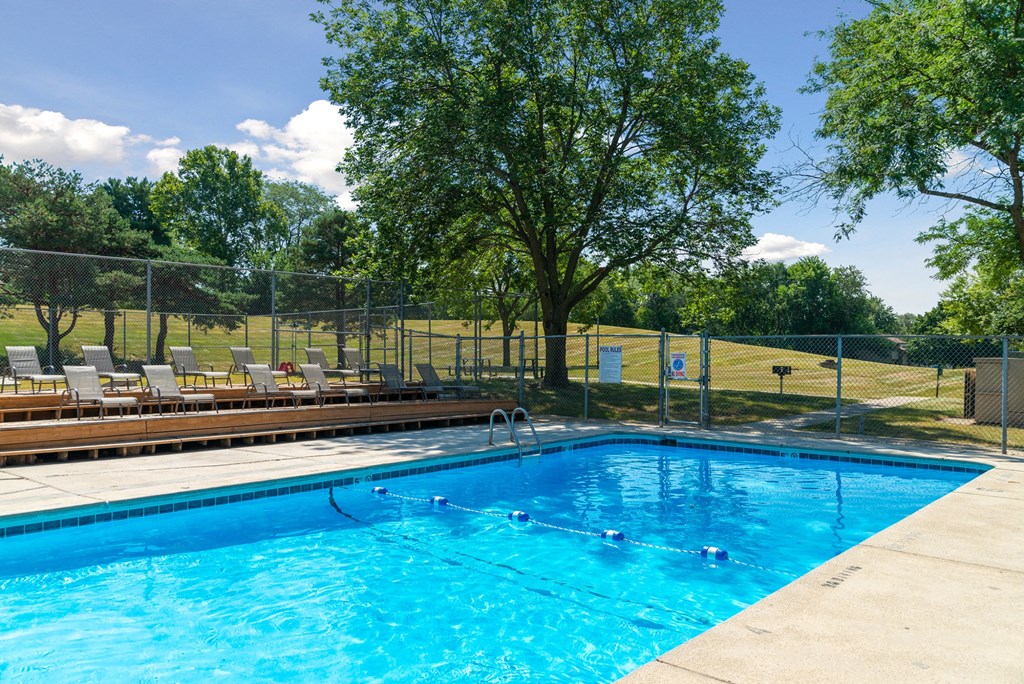 a swimming pool with a fence around it