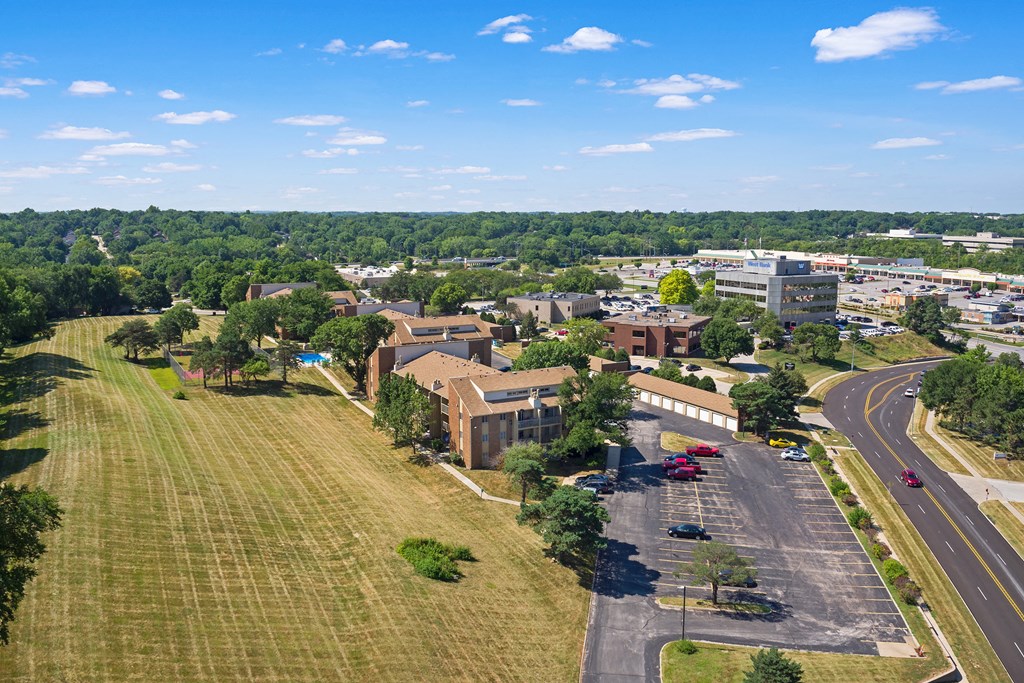 an aerial view of a city with buildings and a highway