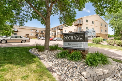 A sign for Sierra Vista in front of a building.