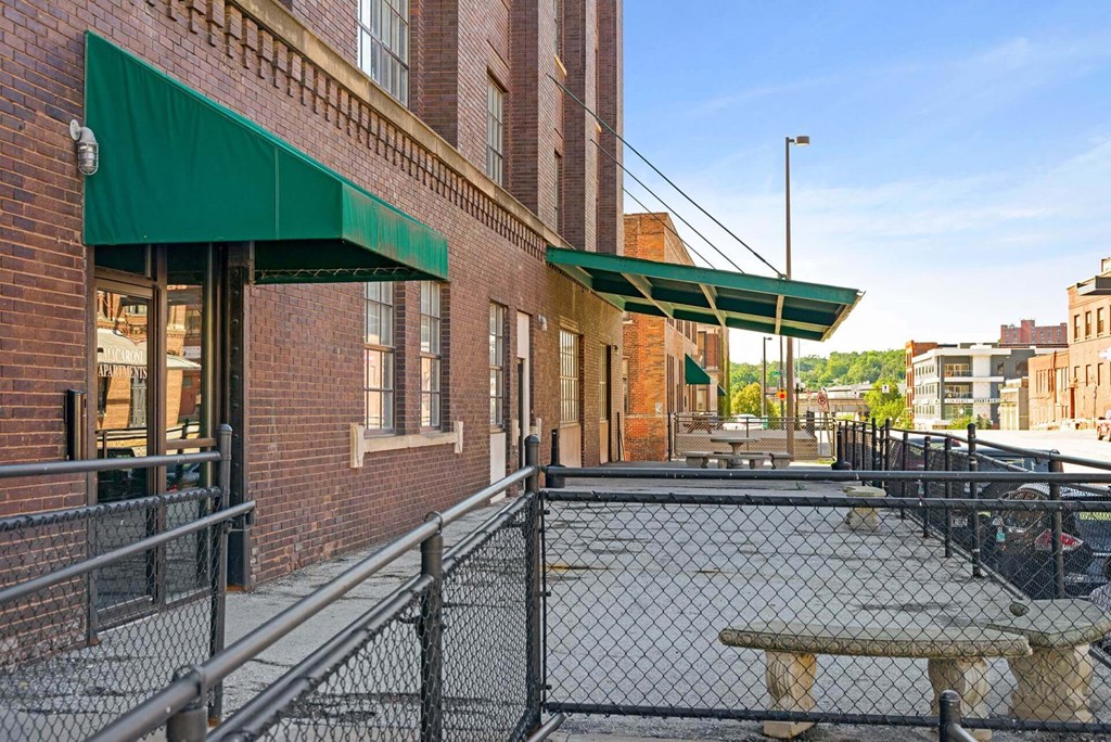 a building with a chain link fence in front of it