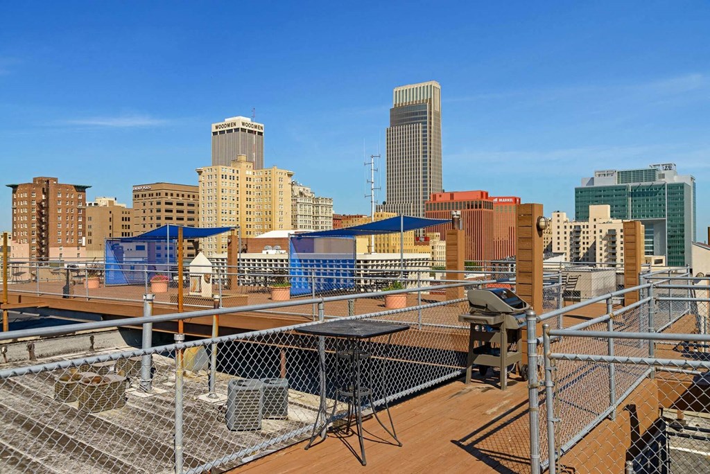 a view of the city skyline from a rooftop construction site