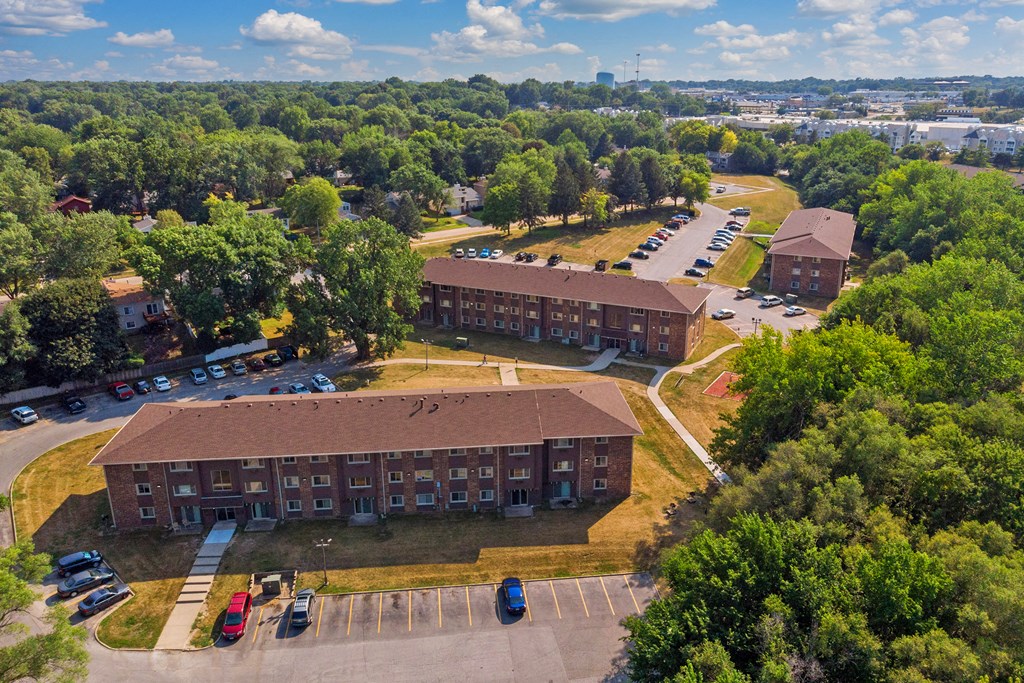 an aerial view of a building in a parking lot
