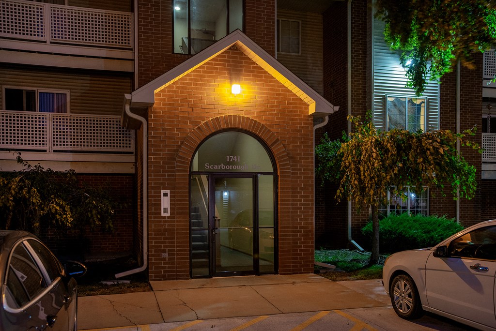 the entrance to a building with a light on top of it
