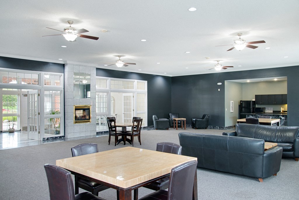 a large living room with couches and a table